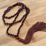 Garnet 108 bead jaap mala shown coiled – Gift Palace India