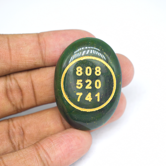 Green aventurine tumble with zibu symbol 1080