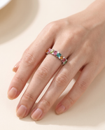 Close-up of hand wearing natural tourmaline eternity ring