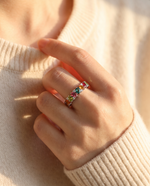 Lifestyle shot of model wearing natural tourmaline eternity ring in golden hour light