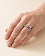 Close-up of hand wearing natural tourmaline pear-cut ring