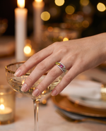 Lifestyle shot of model wearing natural tourmaline ring at evening dinner
