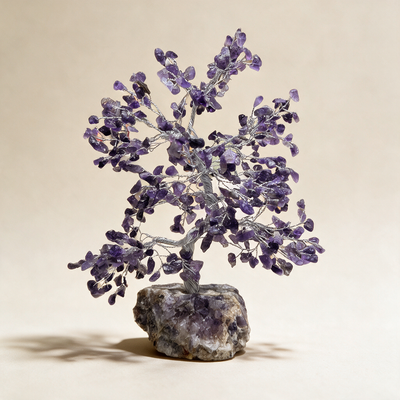 Amethyst crystal tree on an ivory background, purple stone chips on a raw amethyst cluster base