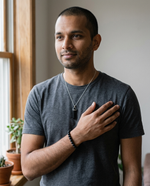 Model wearing the black tourmaline bracelet and pencil pendant from The Protection Ritual