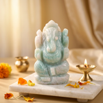 Amazonite Ganesh ji in pooja corner with brass diya and marigold