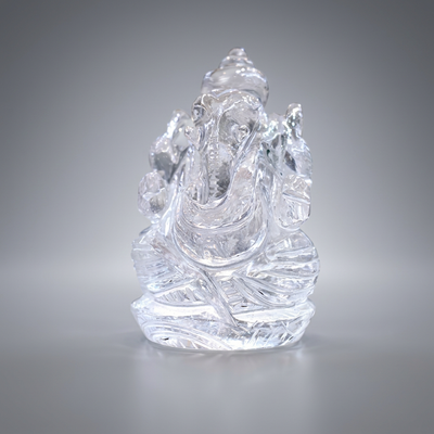 Clear Quartz Ganesha idol on soft grey background — Gift Palace India