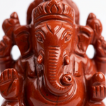 Close-up of natural red jasper Ganesha carving