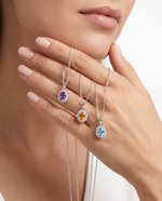 Enché Royale Halo Pendant collection worn — amethyst, citrine, blue topaz on model