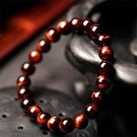 Red tiger eye crystal bracelet worn on the wrist – Gift Palace India